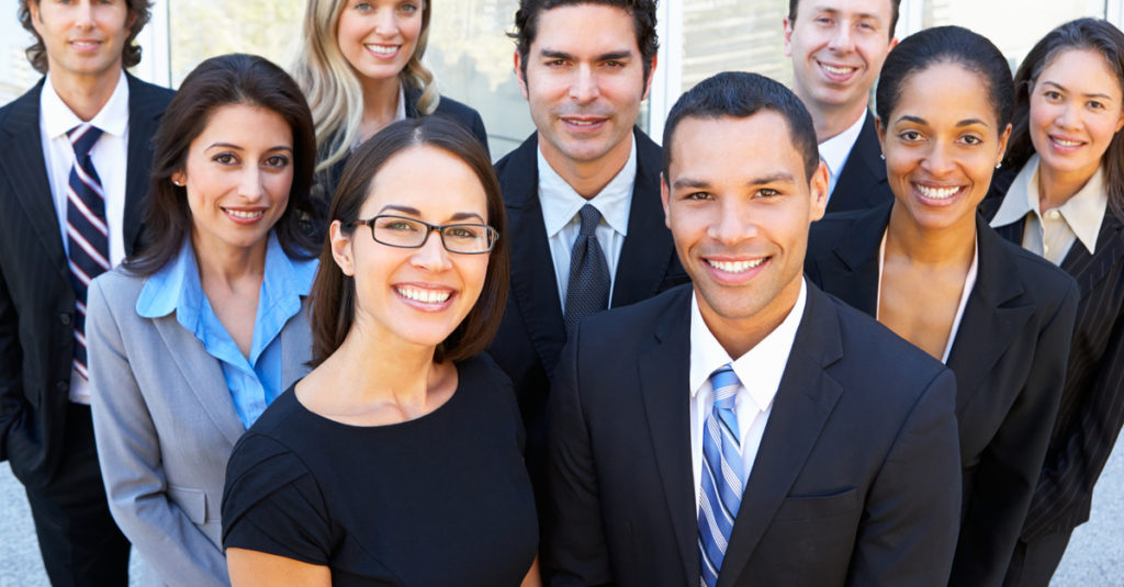A group of people in suits and ties standing together.