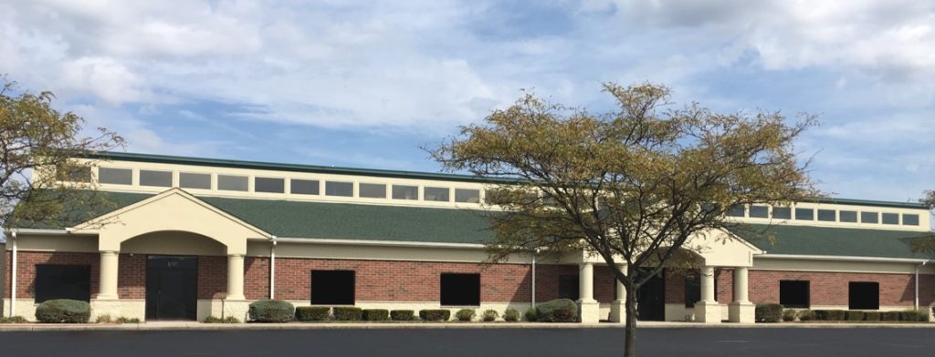 A building with a tree in front of it