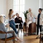 A group of people sitting around in a room.