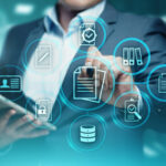 A man in a suit is holding a smart phone